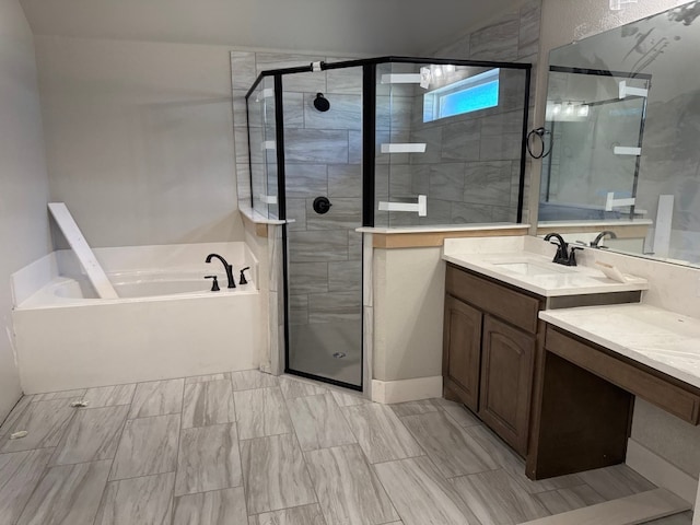 bathroom with vanity and separate shower and tub