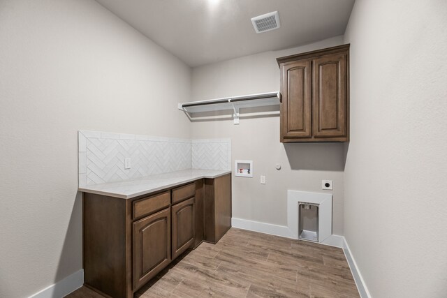 2021 Crystal Palace Blvd, Alvarado, TX 76009 - laundry area with electric dryer hookup, cabinet space, gas dryer hookup, visible vents, and baseboards