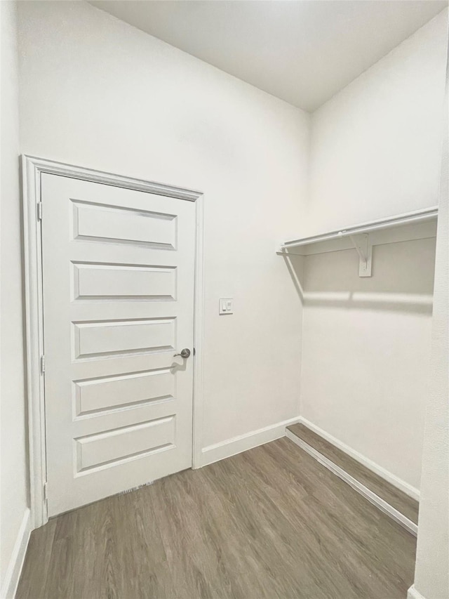 1511 W 13th Ave, Corsicana, TX 75110 - spacious closet featuring wood finished floors