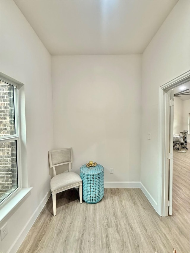 sitting room with light hardwood / wood-style flooring