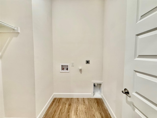 laundry room with washer hookup, light wood-type flooring, hookup for an electric dryer, and gas dryer hookup