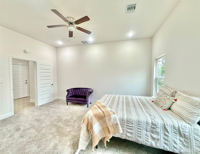 bedroom featuring ceiling fan and carpet