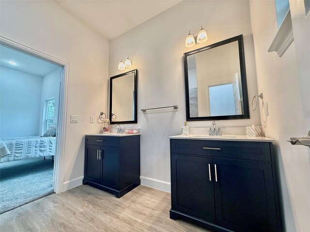 bathroom featuring wood-type flooring and toilet