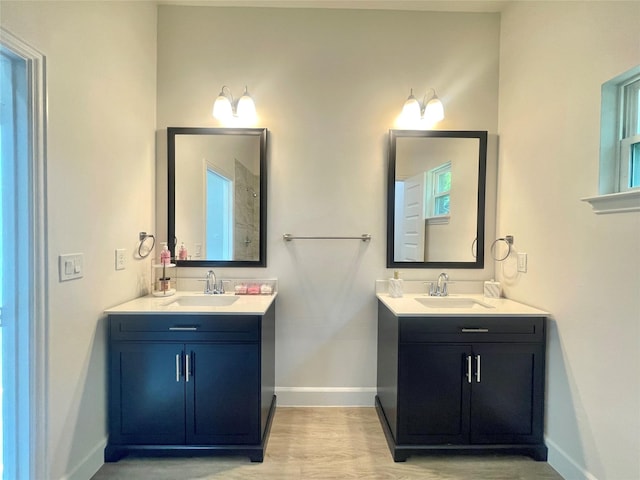 1511 W 13th Ave, Corsicana, TX 75110 - bathroom with two vanities and wood finished floors