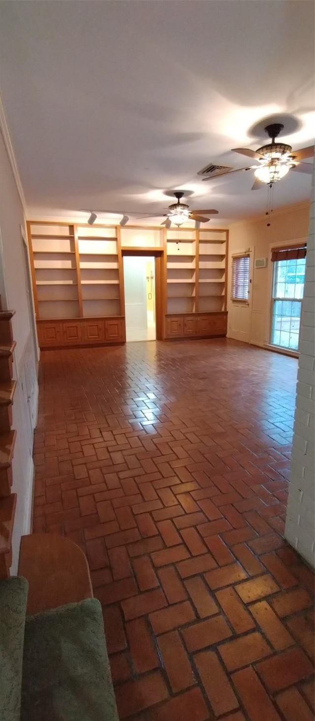 unfurnished room featuring ceiling fan