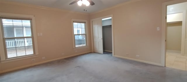 unfurnished bedroom featuring crown molding, light carpet, and ceiling fan