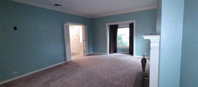 carpeted spare room with ornamental molding