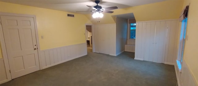 unfurnished bedroom with ceiling fan and carpet floors