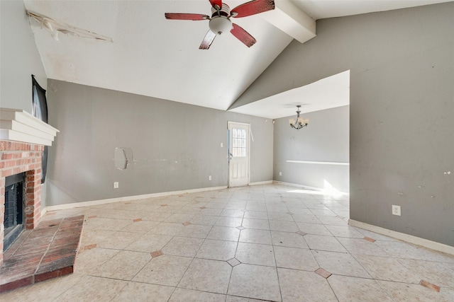 unfurnished living room featuring light tile patterned floors, beam ceiling, high vaulted ceiling, a brick fireplace, and ceiling fan with notable chandelier