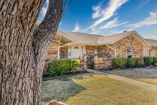 ranch-style house with a front yard