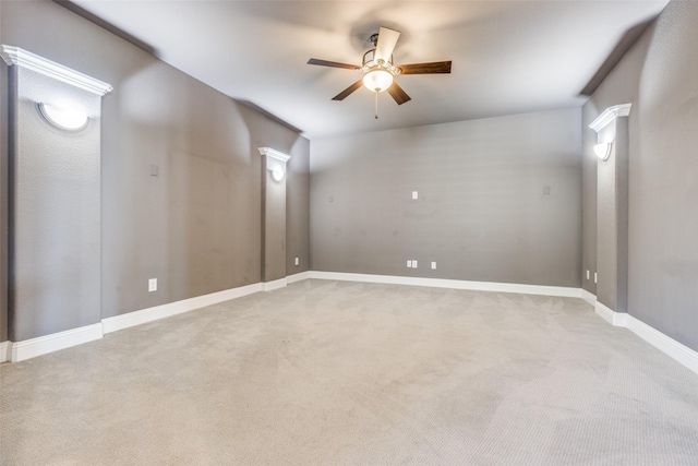 unfurnished room featuring ceiling fan and light carpet