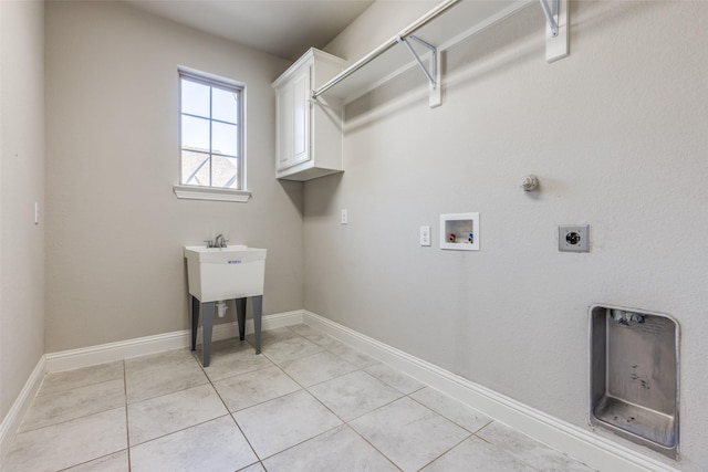 washroom featuring washer hookup, light tile patterned flooring, cabinets, and hookup for an electric dryer