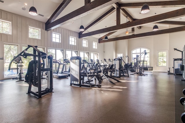 gym with plenty of natural light and high vaulted ceiling