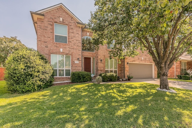 view of front of property featuring a garage and a front lawn