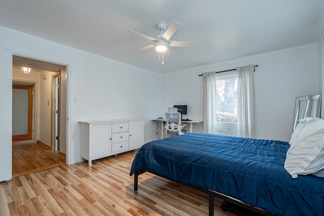 bedroom with ceiling fan and light hardwood / wood-style flooring