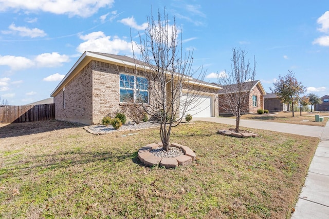 ranch-style house featuring a garage and a front yard