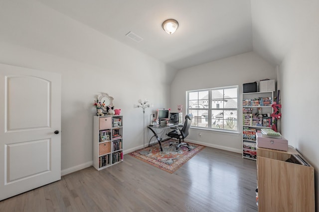 office featuring lofted ceiling and wood-type flooring