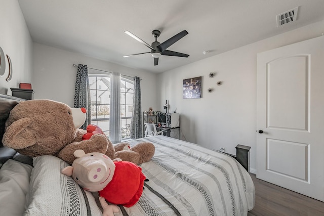 bedroom featuring dark hardwood / wood-style floors and ceiling fan