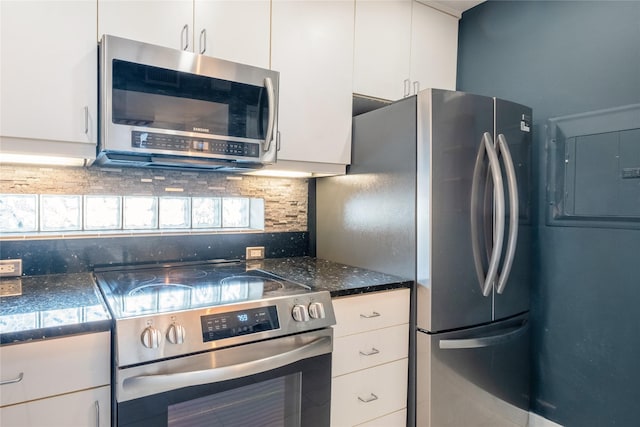 kitchen featuring white cabinetry, decorative backsplash, electric panel, and appliances with stainless steel finishes