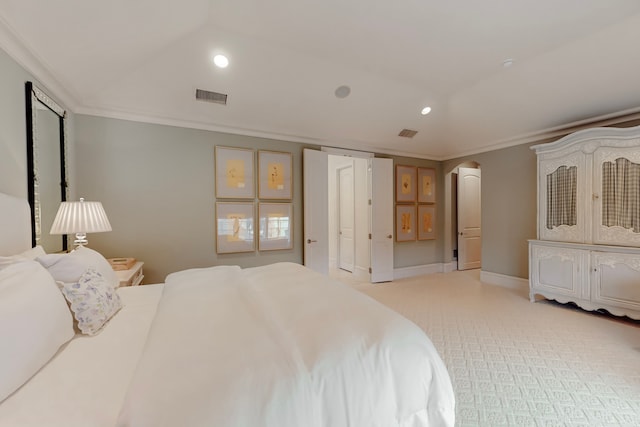 bedroom with ornamental molding and light carpet