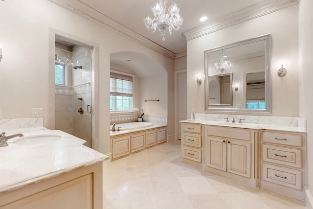 bathroom featuring vanity, separate shower and tub, ornamental molding, and a notable chandelier