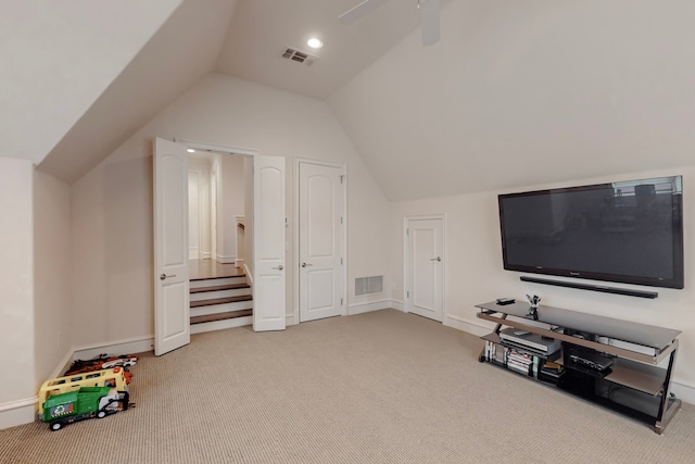 additional living space with ceiling fan, lofted ceiling, and carpet