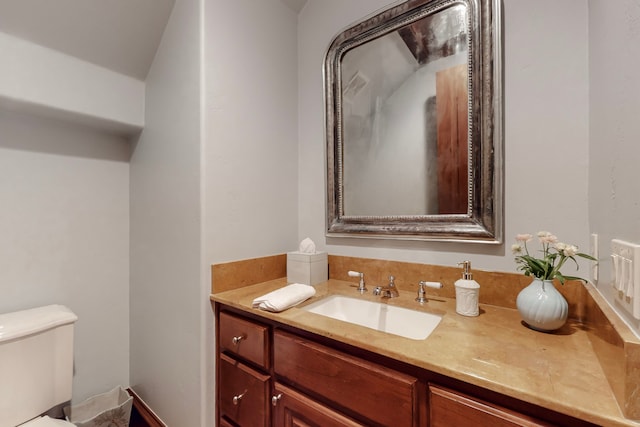 bathroom with vanity and toilet