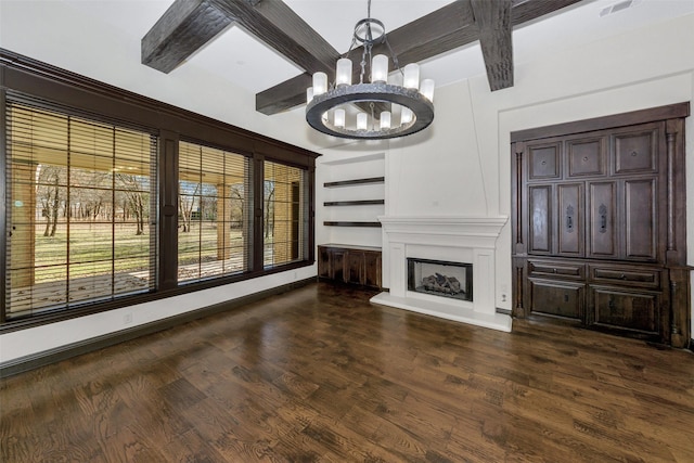 unfurnished living room featuring an inviting chandelier, beam ceiling, dark hardwood / wood-style floors, coffered ceiling, and a fireplace