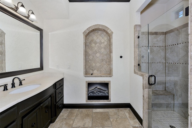 bathroom featuring vanity and an enclosed shower