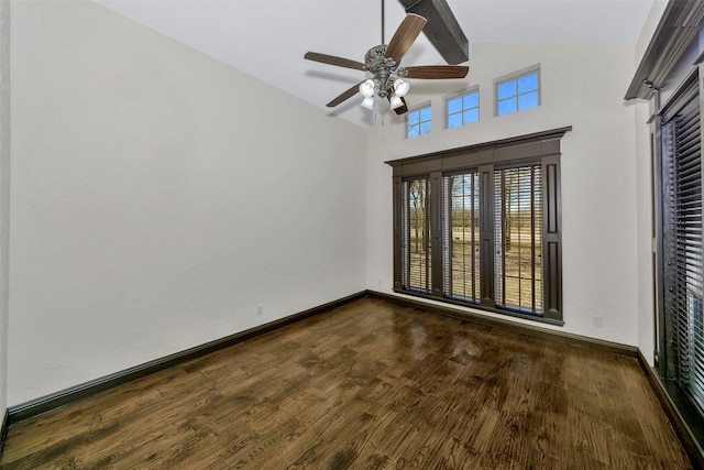 empty room with ceiling fan, dark hardwood / wood-style flooring, and high vaulted ceiling