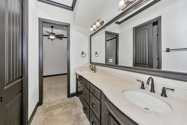 bathroom with crown molding and vanity