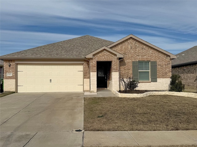 single story home with a garage and a front lawn