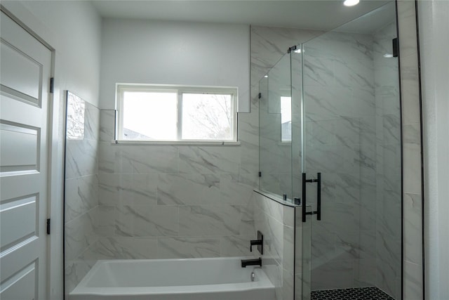 bathroom with separate shower and tub