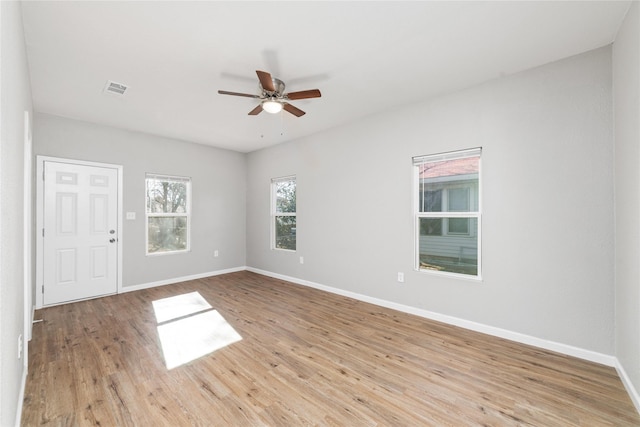 spare room featuring ceiling fan and light hardwood / wood-style flooring