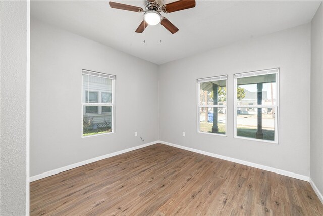 empty room featuring ceiling fan and light hardwood / wood-style floors