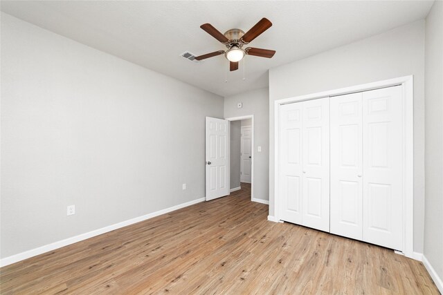 unfurnished room featuring hardwood / wood-style floors and ceiling fan