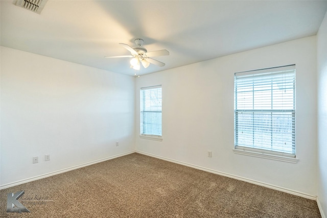 carpeted empty room with ceiling fan