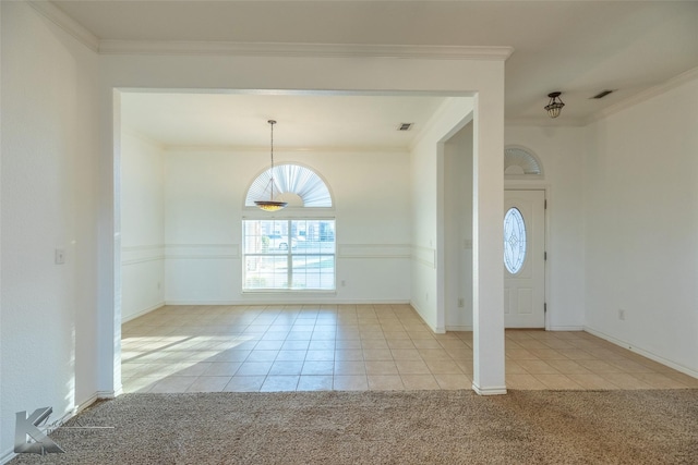 entryway with light carpet and crown molding