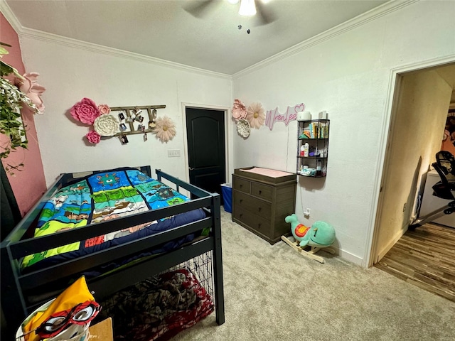 playroom featuring ornamental molding, light carpet, and ceiling fan