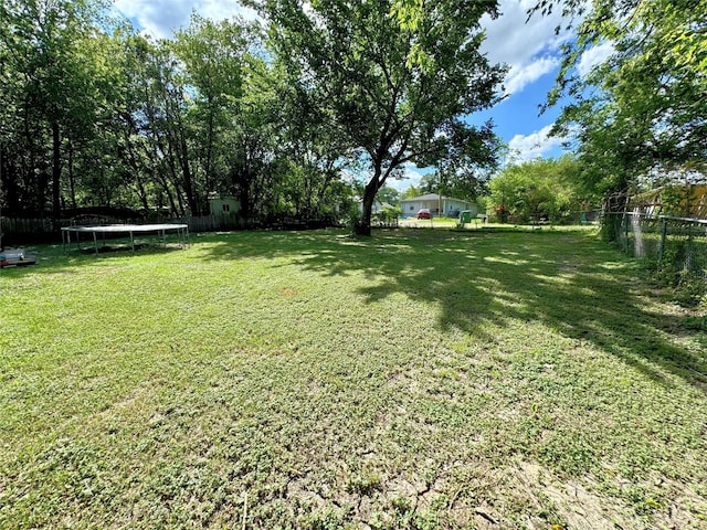 view of yard featuring a trampoline