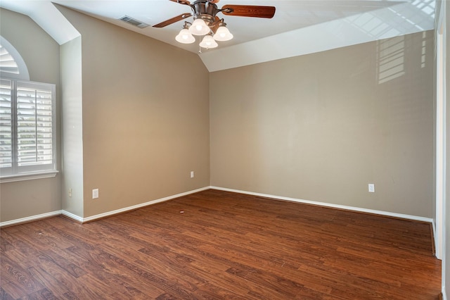 spare room with lofted ceiling, hardwood / wood-style floors, and ceiling fan