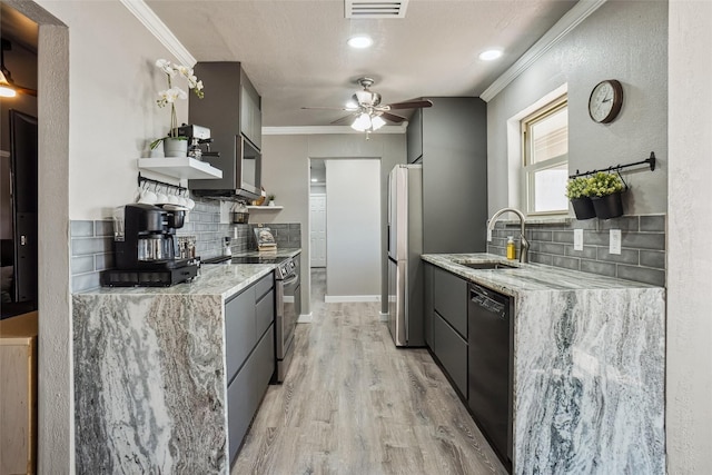 kitchen featuring sink, crown molding, stainless steel appliances, light stone countertops, and light wood-type flooring