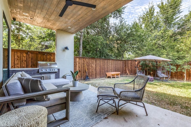 view of patio featuring ceiling fan, grilling area, and area for grilling