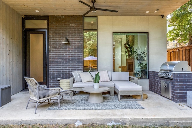 view of patio / terrace with ceiling fan, a grill, outdoor lounge area, and exterior kitchen