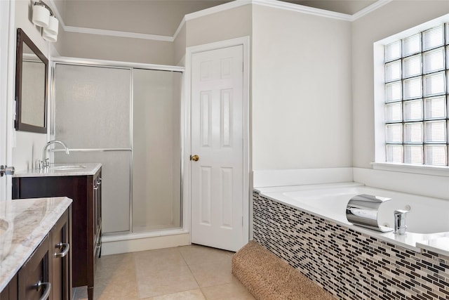 bathroom with tile patterned flooring, crown molding, shower with separate bathtub, and vanity