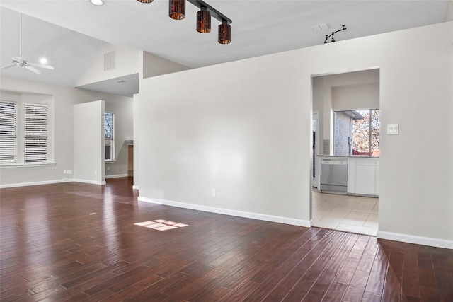 unfurnished living room with hardwood / wood-style flooring, vaulted ceiling, and ceiling fan