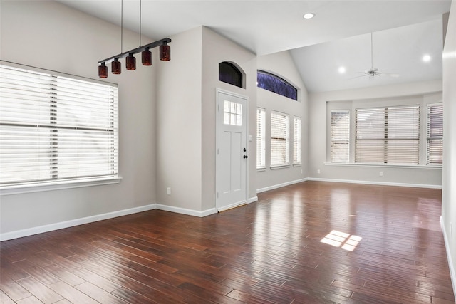 entryway featuring high vaulted ceiling, dark wood-type flooring, and ceiling fan