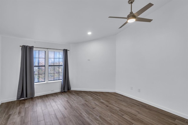 empty room featuring ceiling fan and hardwood / wood-style floors