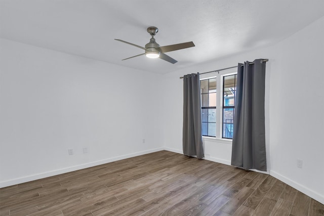 unfurnished room featuring ceiling fan and hardwood / wood-style floors