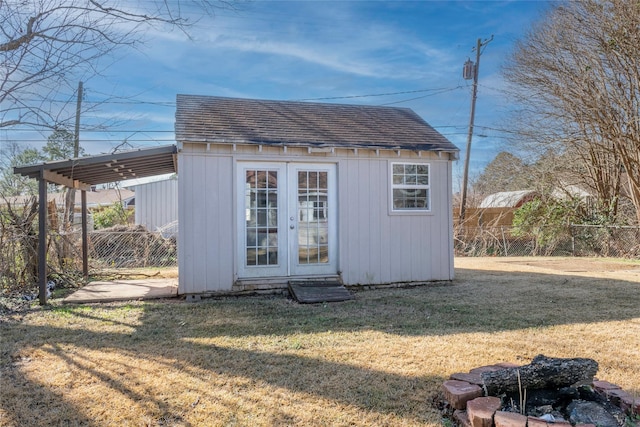 view of outbuilding with a yard